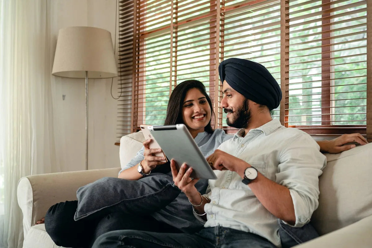 Couple browsing on a tablet at home